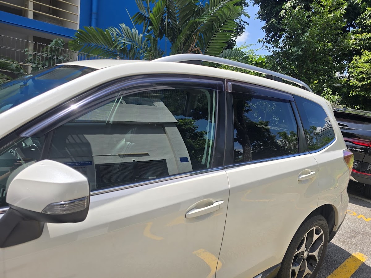 White Subaru Forester detailed to a high gloss, photographed in daylight